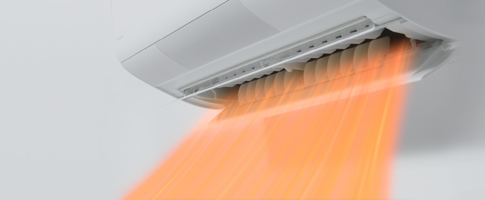エアコンが暖房の気流を吹き出している画像です