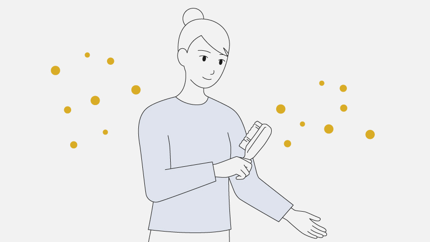 女性が衣類に付着した花粉をブラシで取り除いているイラストです。