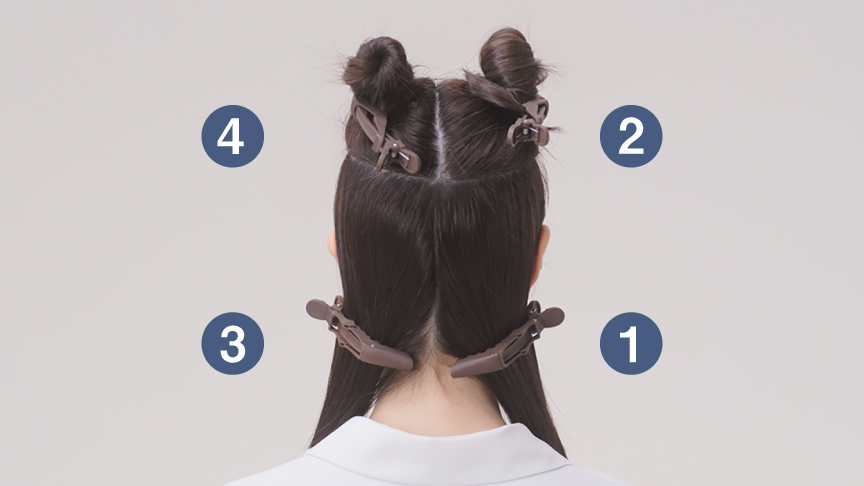 写真：髪全体を4つにブロッキングしている様子