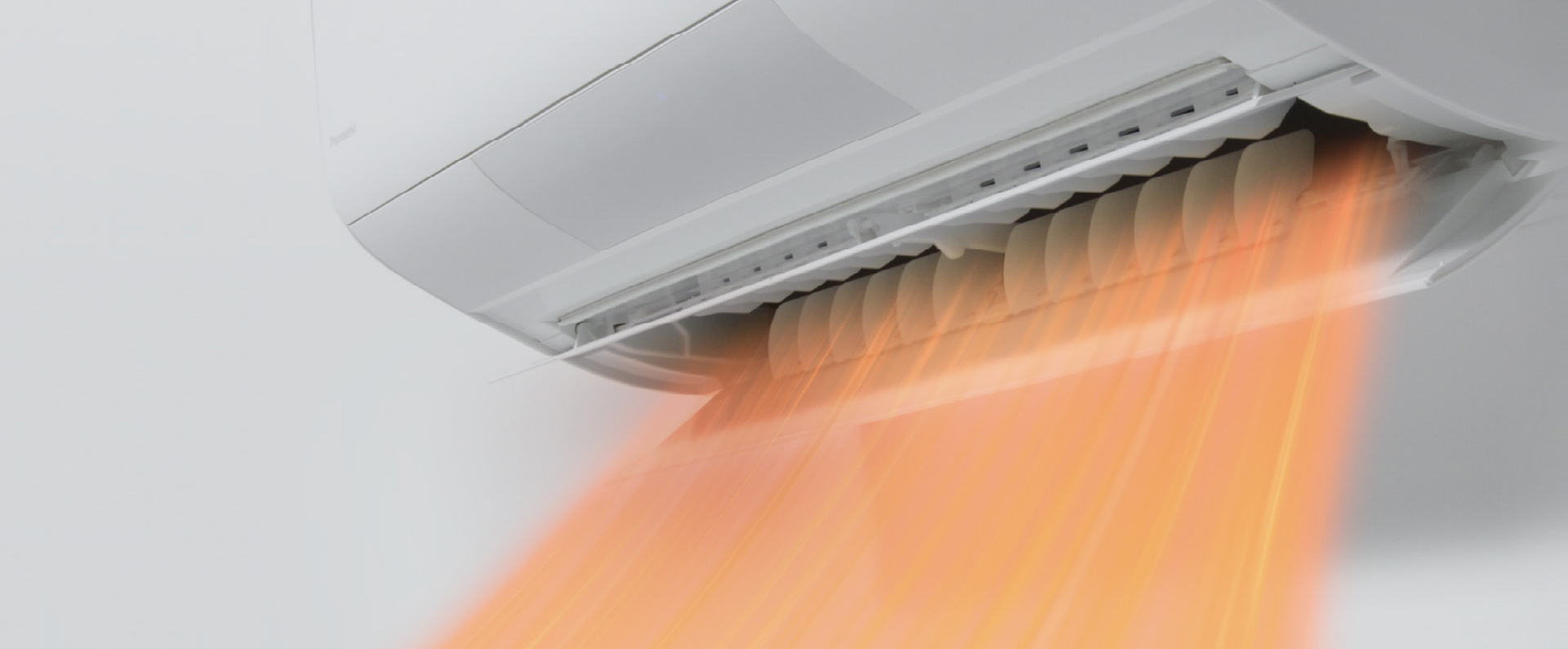 エアコンが暖房の気流を吹き出している画像です