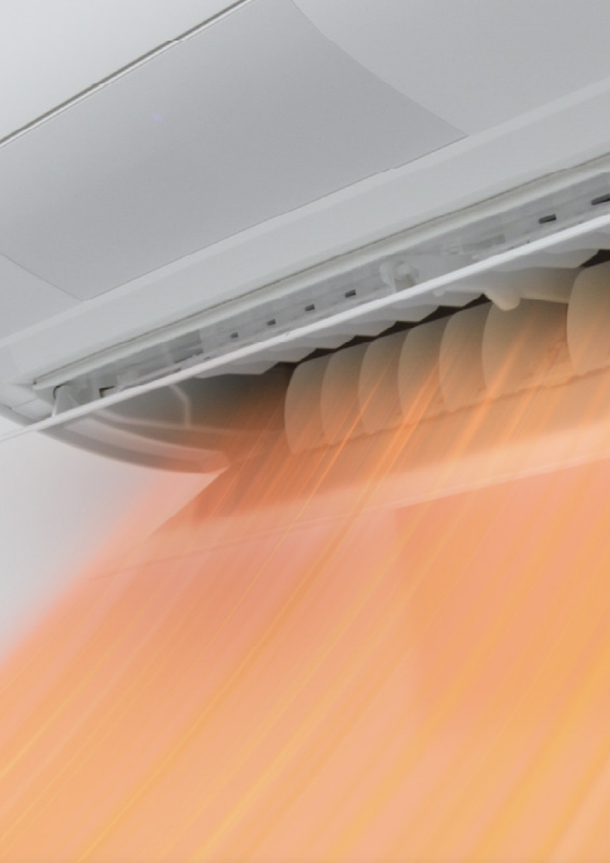 エアコンが暖房の気流を吹き出している画像です