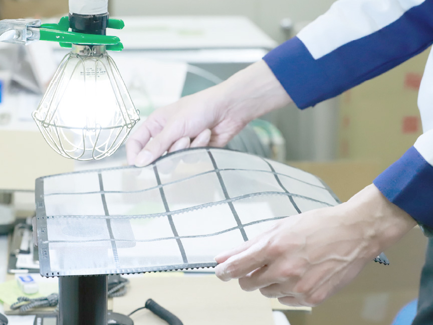 お掃除ロボットの開発者3名の画像です