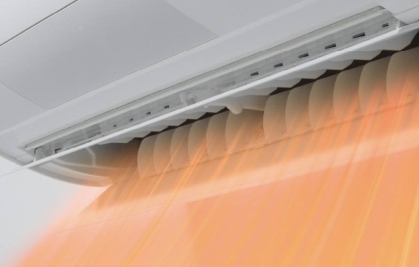 写真：エアコンから温風が出るイメージ