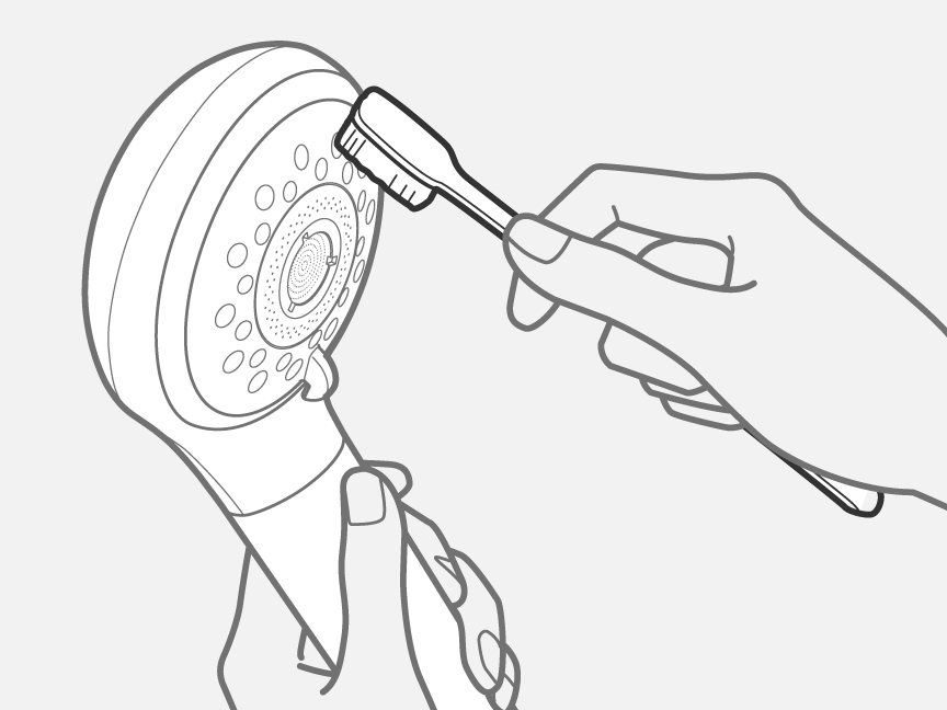 柔らかい歯ブラシなどを使用して汚れを取り除いているイメージ