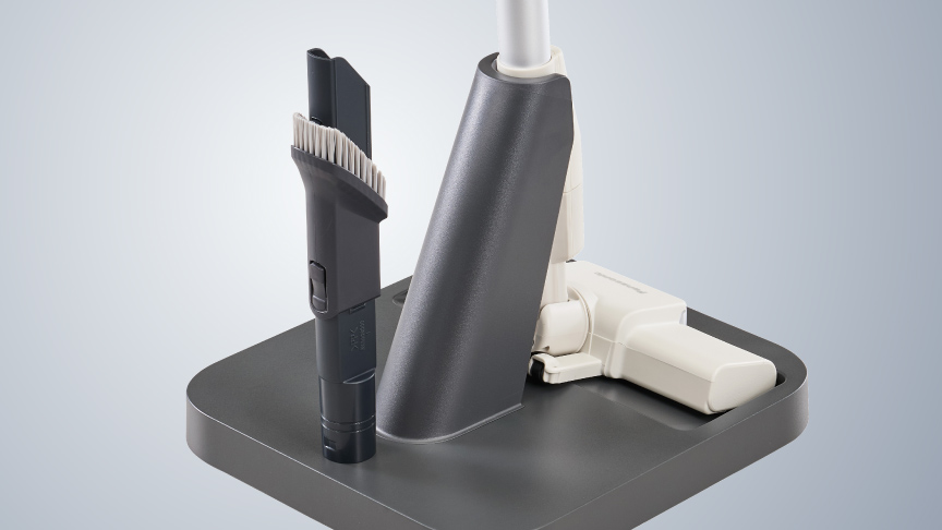 写真：スタンドにアタッチメントノズルをしまう様子