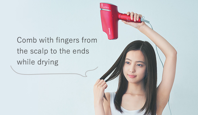 Comb with fingers from the scalp to the ends while drying
